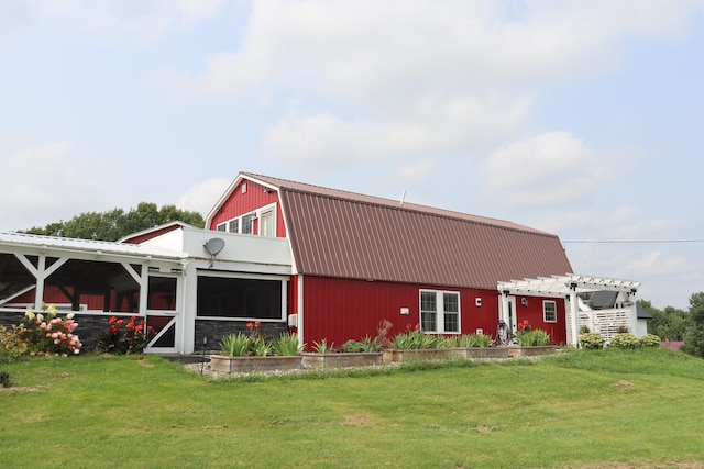 exterior space with a lawn and a pergola