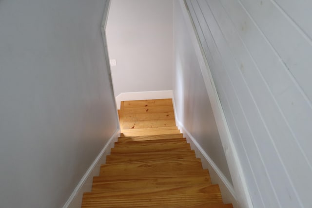 stairway featuring hardwood / wood-style flooring