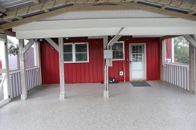 doorway to property with a carport