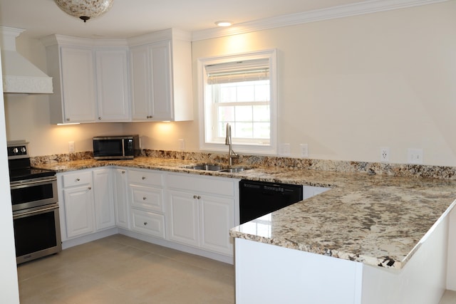 kitchen with sink, wall chimney range hood, white cabinetry, stainless steel appliances, and light stone countertops