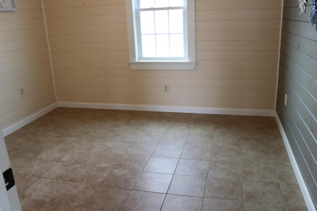 unfurnished room with light tile patterned floors