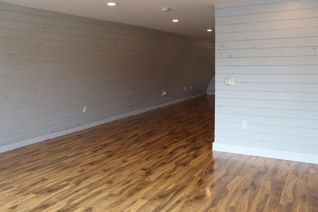 spare room featuring dark hardwood / wood-style flooring