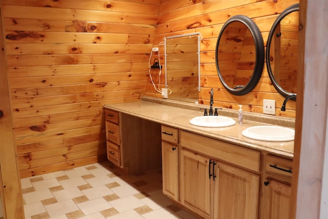 bathroom featuring vanity and wooden walls