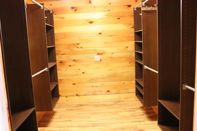 walk in closet featuring light hardwood / wood-style floors