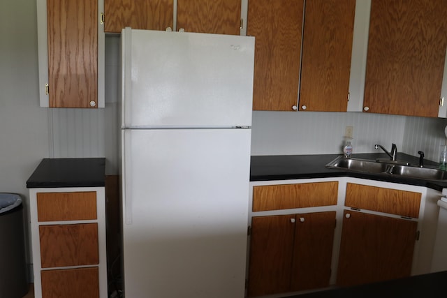 kitchen featuring white fridge and sink