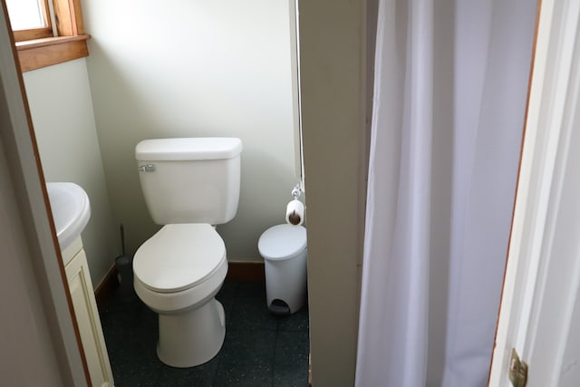 bathroom featuring vanity and toilet