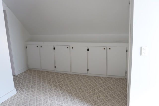 bonus room featuring vaulted ceiling