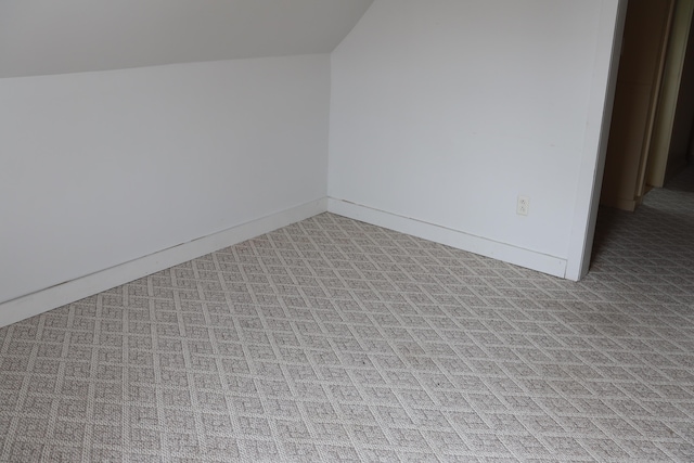 bonus room featuring vaulted ceiling