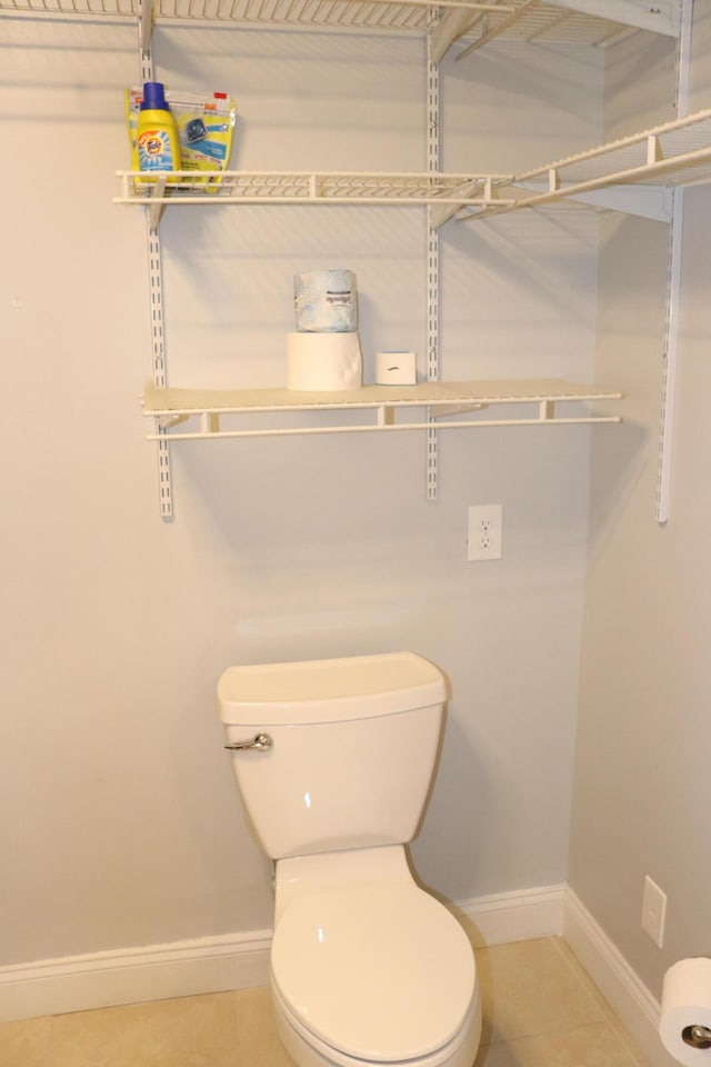 bathroom featuring toilet and tile patterned floors