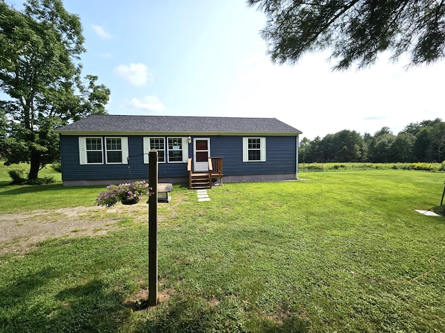 view of front facade featuring a front yard