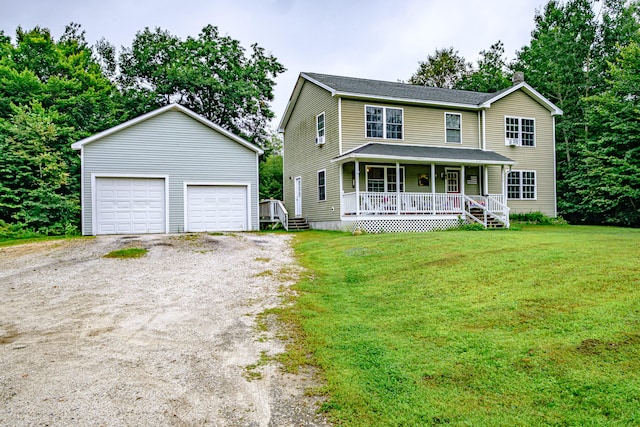 view of front facade featuring a front lawn, a garage, and a porch