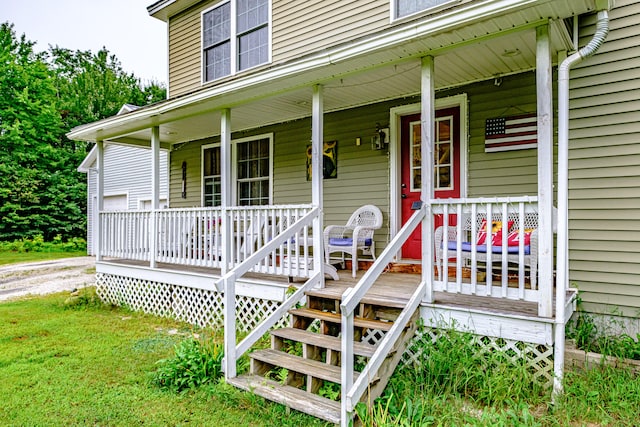 view of exterior entry with a porch