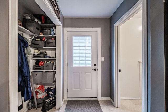 doorway to outside featuring light tile patterned floors