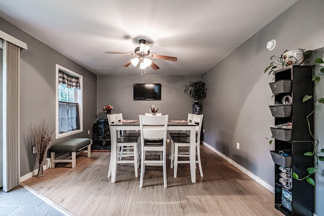 dining space featuring hardwood / wood-style floors and ceiling fan