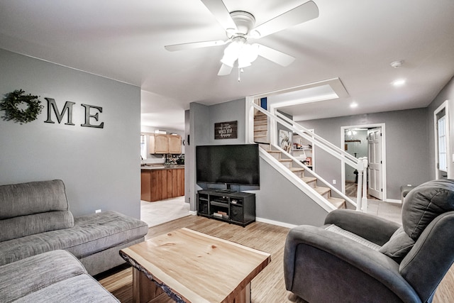 tiled living room with ceiling fan