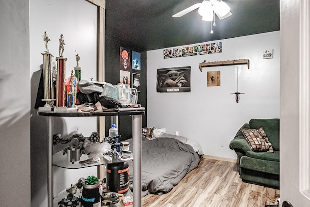 bedroom featuring light hardwood / wood-style floors and ceiling fan