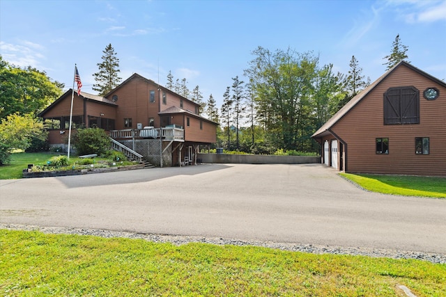 view of street featuring stairs and driveway