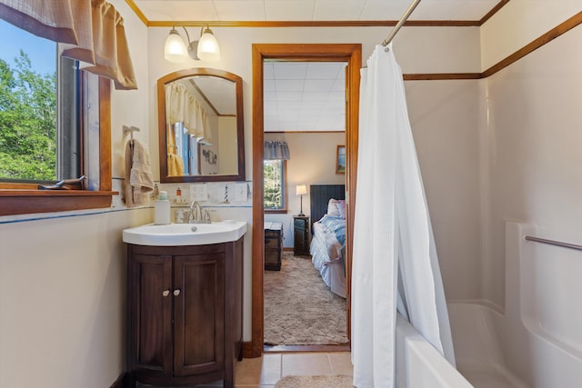 full bathroom featuring shower / bath combo, crown molding, vanity, and ensuite bath