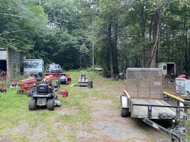 view of yard featuring a forest view