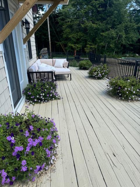 67 Tacconet Rd, Palmyra, ME 04965 - wooden terrace featuring an outdoor living space