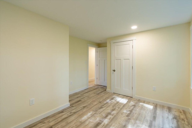 unfurnished room with light hardwood / wood-style flooring