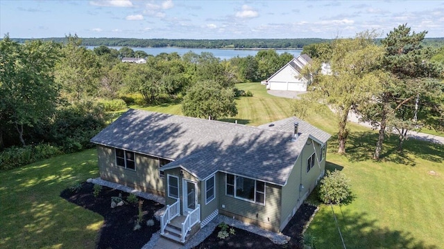 birds eye view of property with a water view