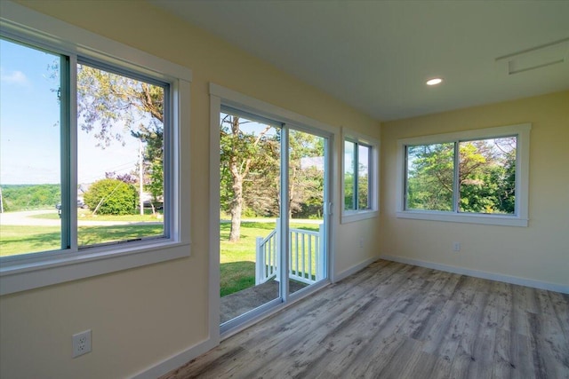 unfurnished sunroom with plenty of natural light