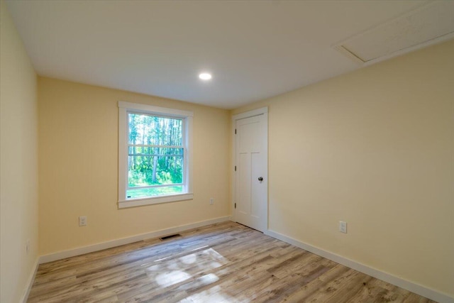 unfurnished room featuring light hardwood / wood-style floors