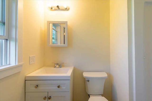 bathroom featuring toilet and vanity