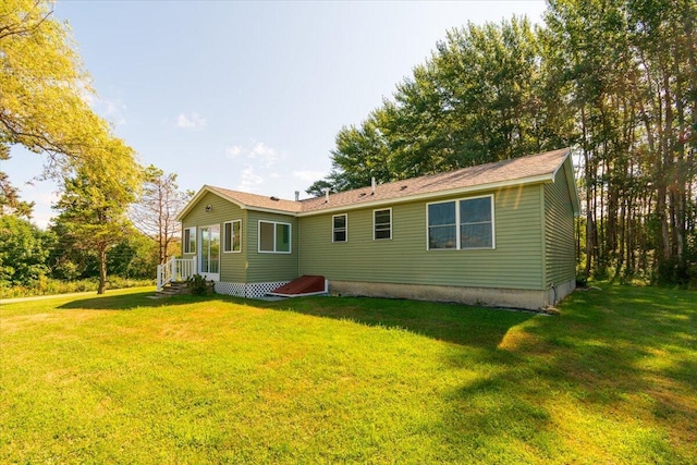 back of house with a yard