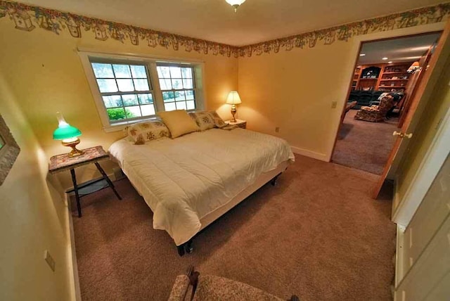 bedroom featuring dark carpet