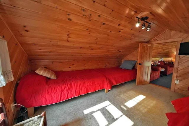 carpeted bedroom with lofted ceiling, wood walls, and wooden ceiling