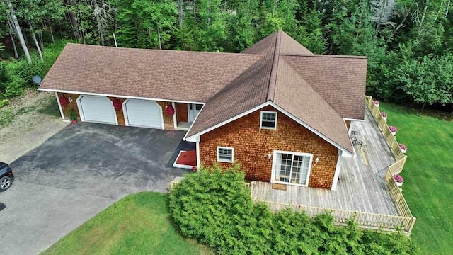 view of front of house with a front yard and a garage