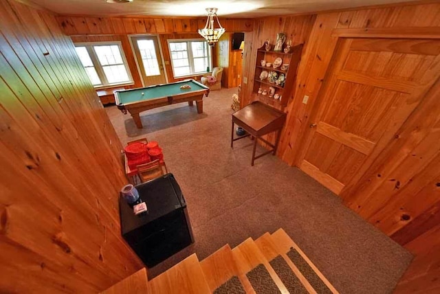 game room with a notable chandelier, billiards, carpet floors, and wooden walls