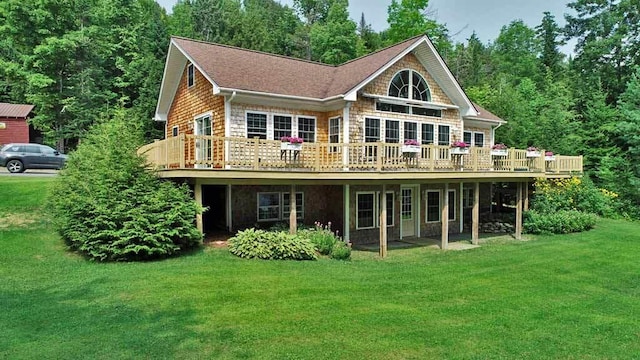 back of house featuring a yard and a deck