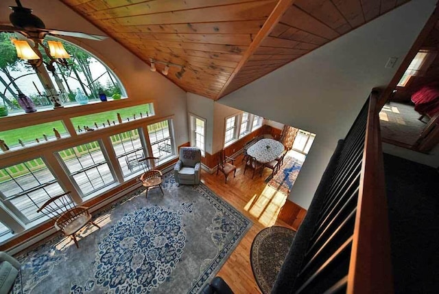 living room with high vaulted ceiling, hardwood / wood-style flooring, and wood ceiling