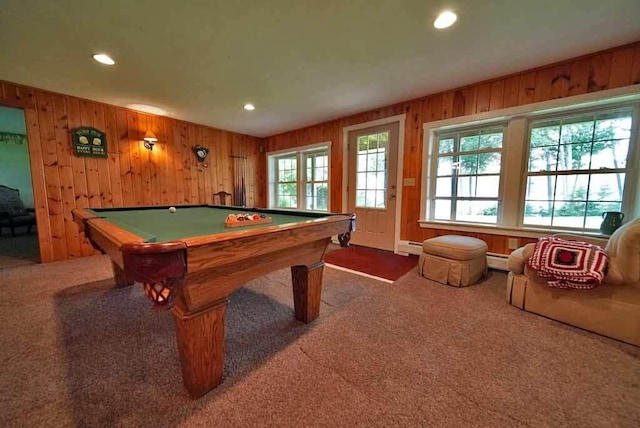 playroom with carpet floors, a healthy amount of sunlight, and baseboard heating