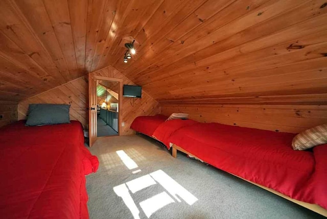 carpeted bedroom featuring wood ceiling, vaulted ceiling, and wooden walls