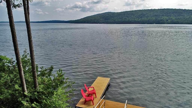 dock area featuring a water and mountain view