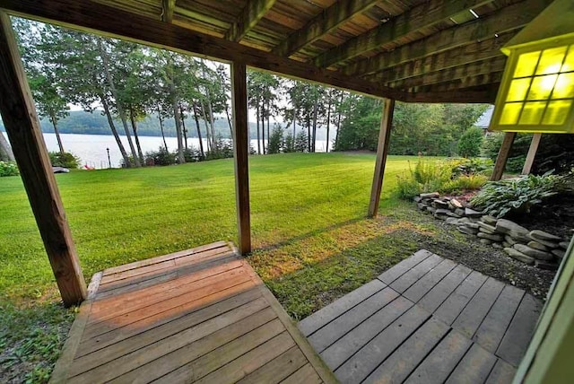 view of yard featuring a deck with water view