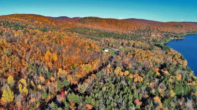 aerial view featuring a water and mountain view