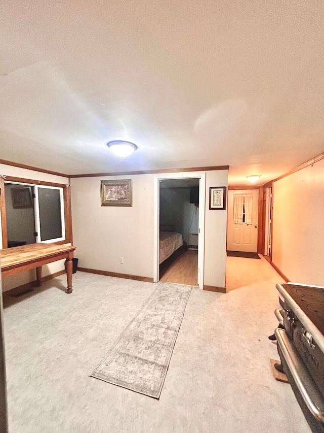 basement with a textured ceiling and light carpet