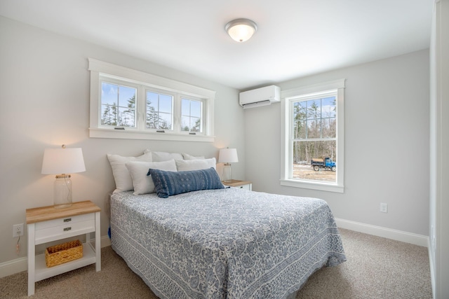 carpeted bedroom featuring a wall unit AC and baseboards