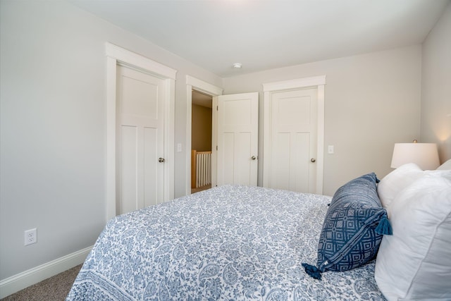 carpeted bedroom with baseboards