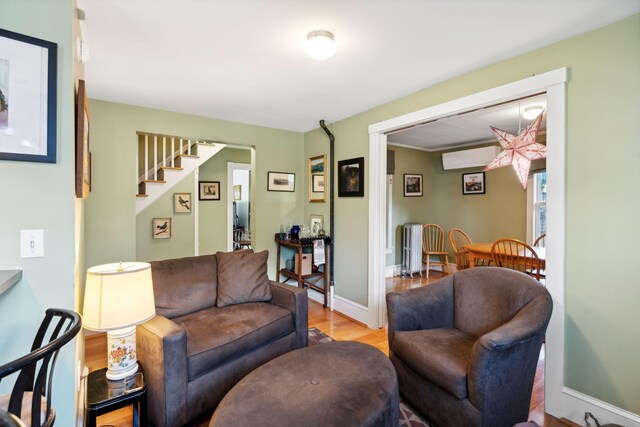 living room featuring radiator and light hardwood / wood-style floors