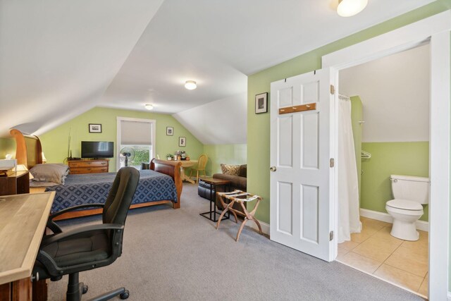 office with lofted ceiling and light carpet