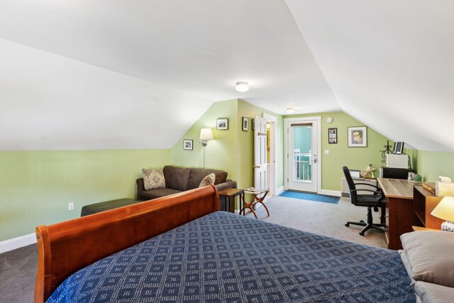 bedroom featuring lofted ceiling, access to exterior, and carpet floors