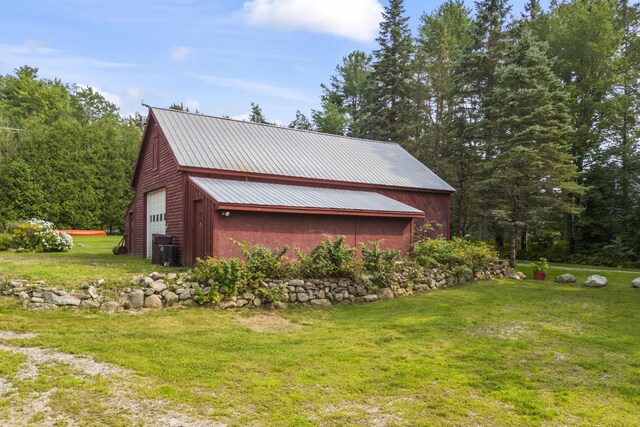 view of side of property with a yard