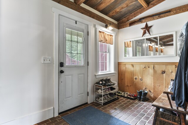 entryway with lofted ceiling and wood ceiling