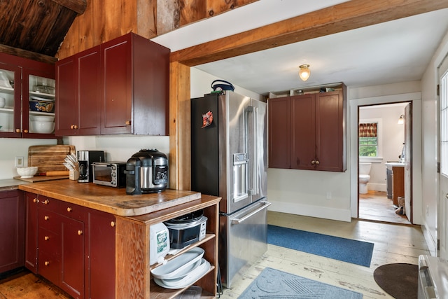 kitchen featuring high end fridge, light hardwood / wood-style flooring, lofted ceiling, and wood ceiling